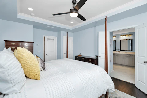 a bedroom with a large bed in a room