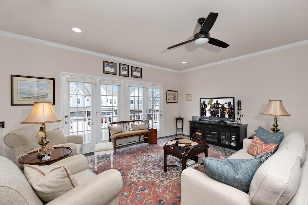 a living room filled with furniture and a flat screen tv