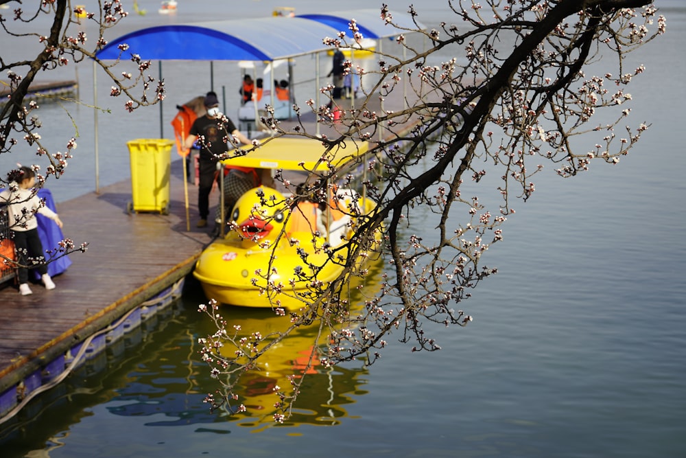 a yellow and black gondola on a river