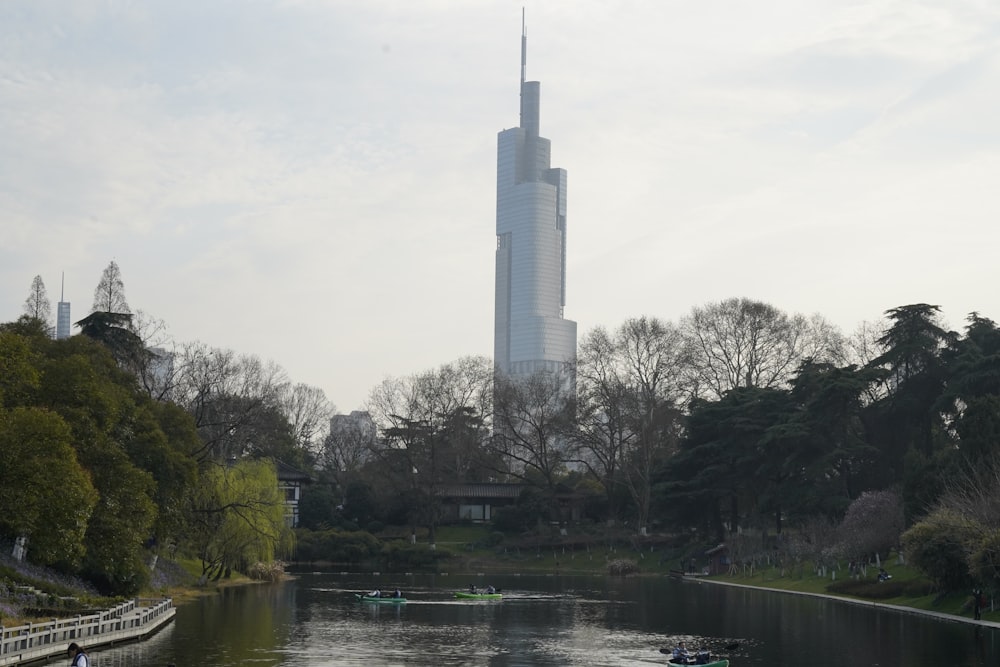 a tall building by a river