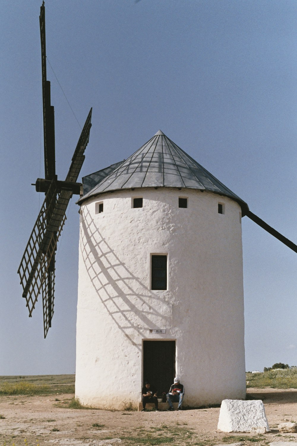 a white building with a windmill