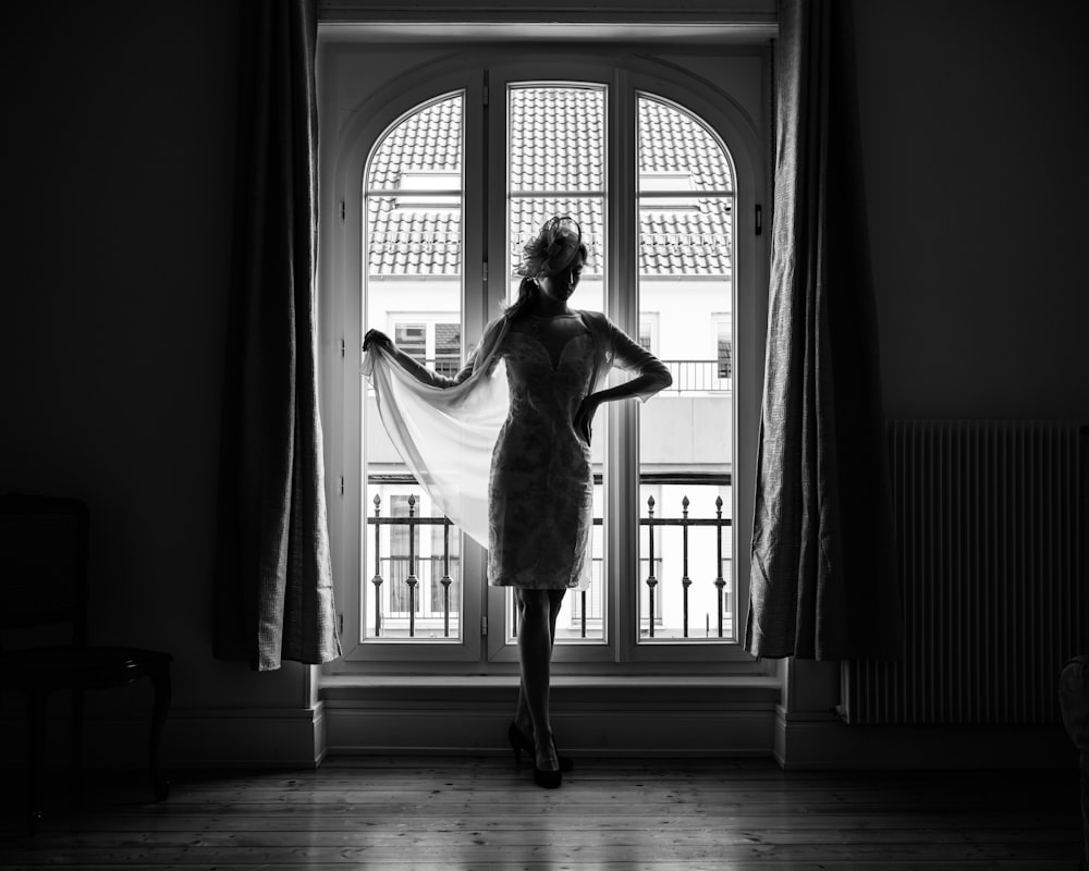 a person standing in front of a window