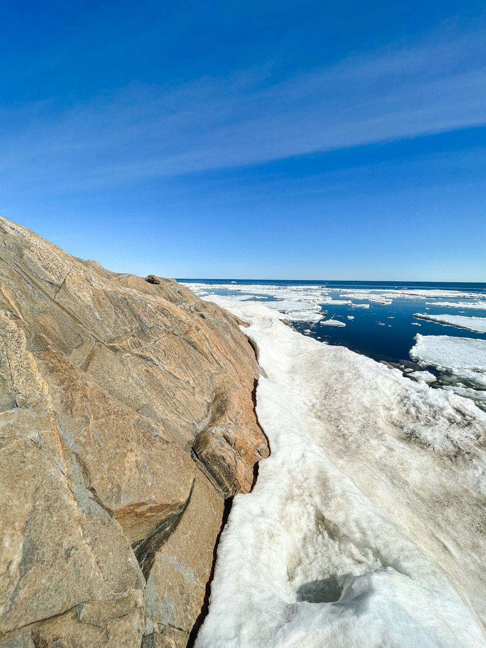 a rocky beach with waves crashing