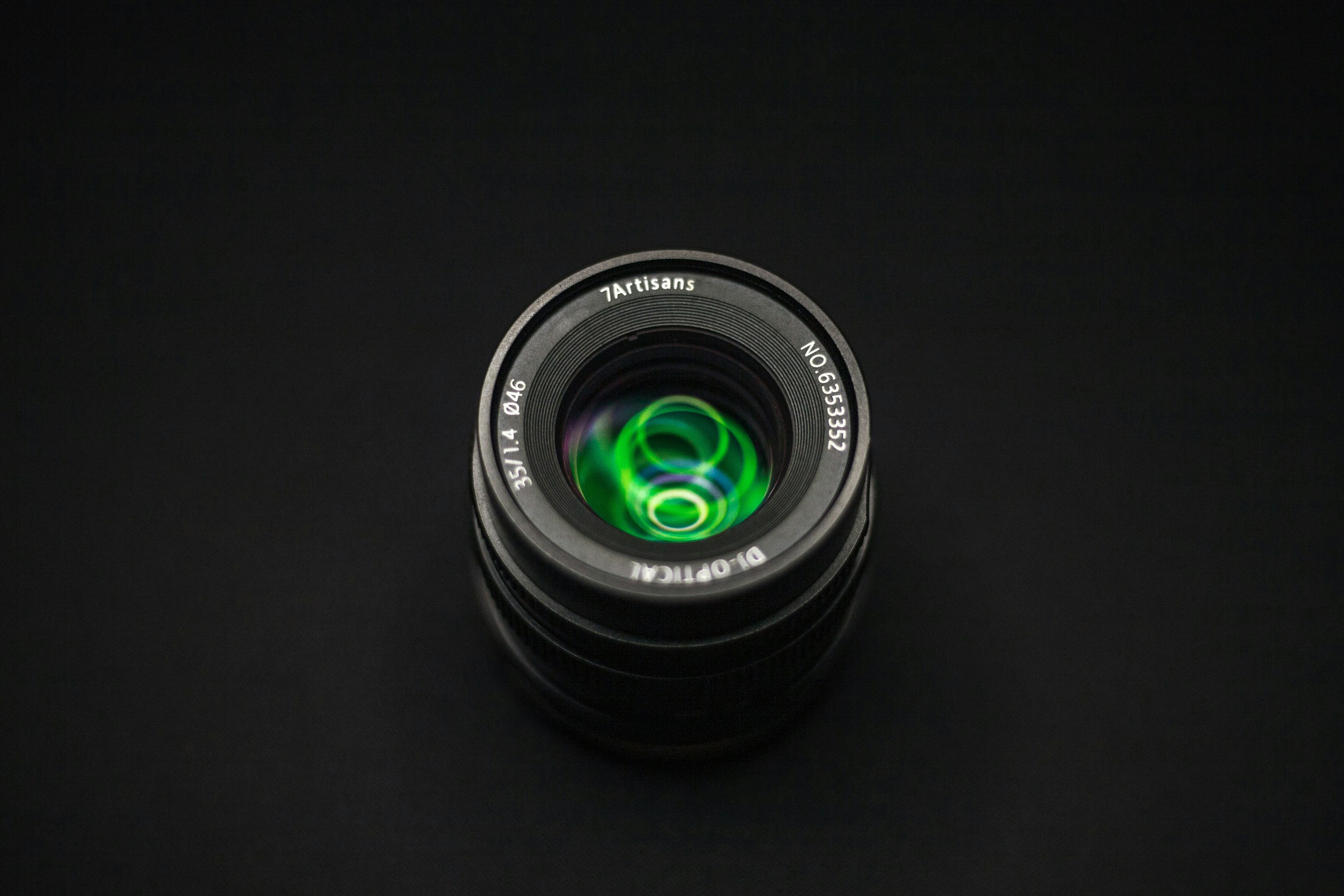 a camera lens with a green light