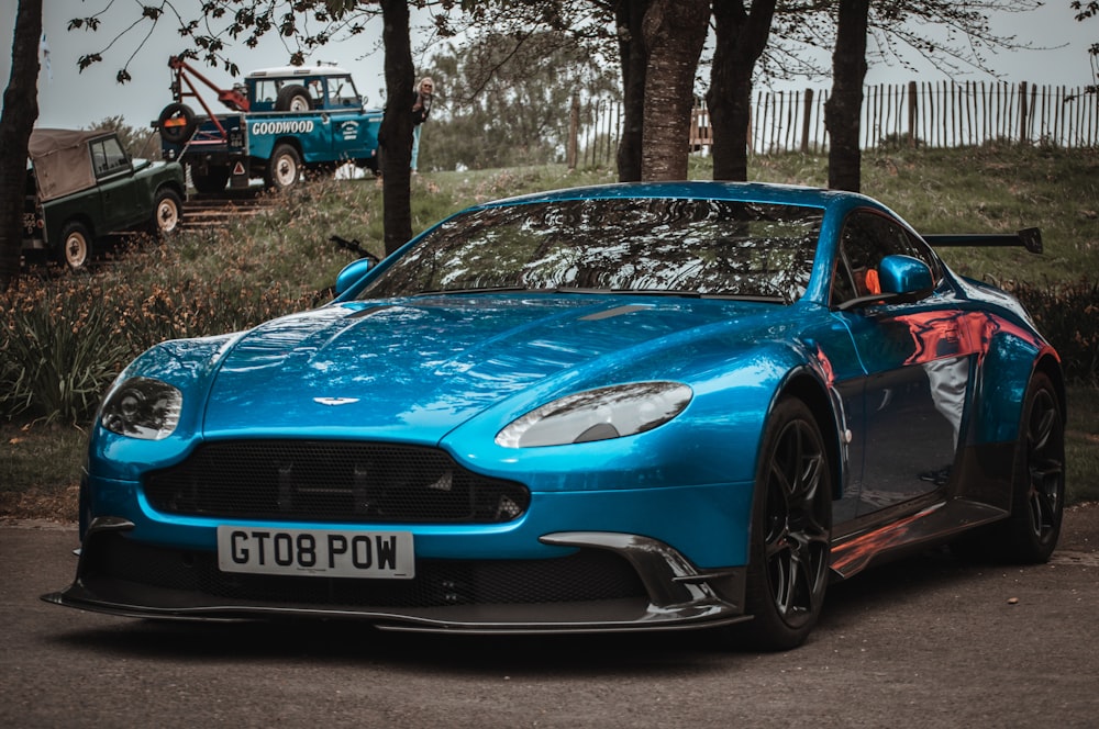 a blue car parked on the side of the road