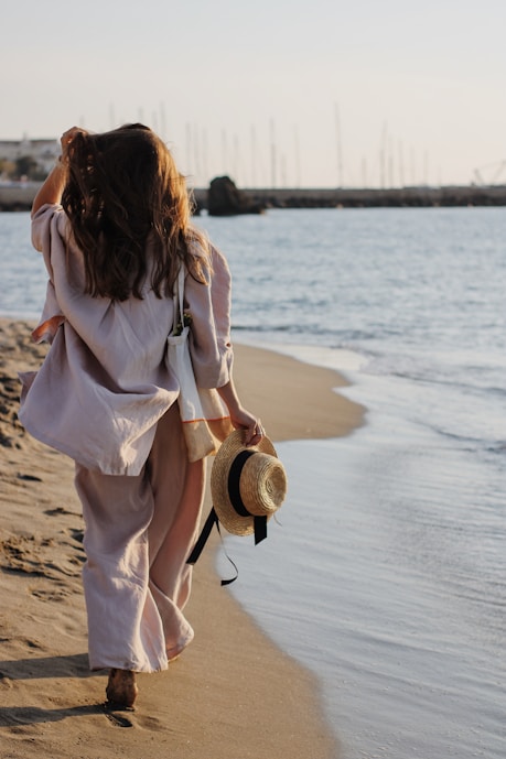 a model walking on a beach, menorca scouting