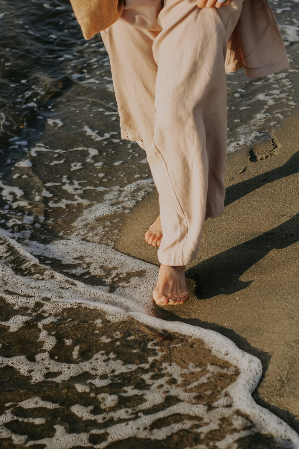 a person walking on a beach