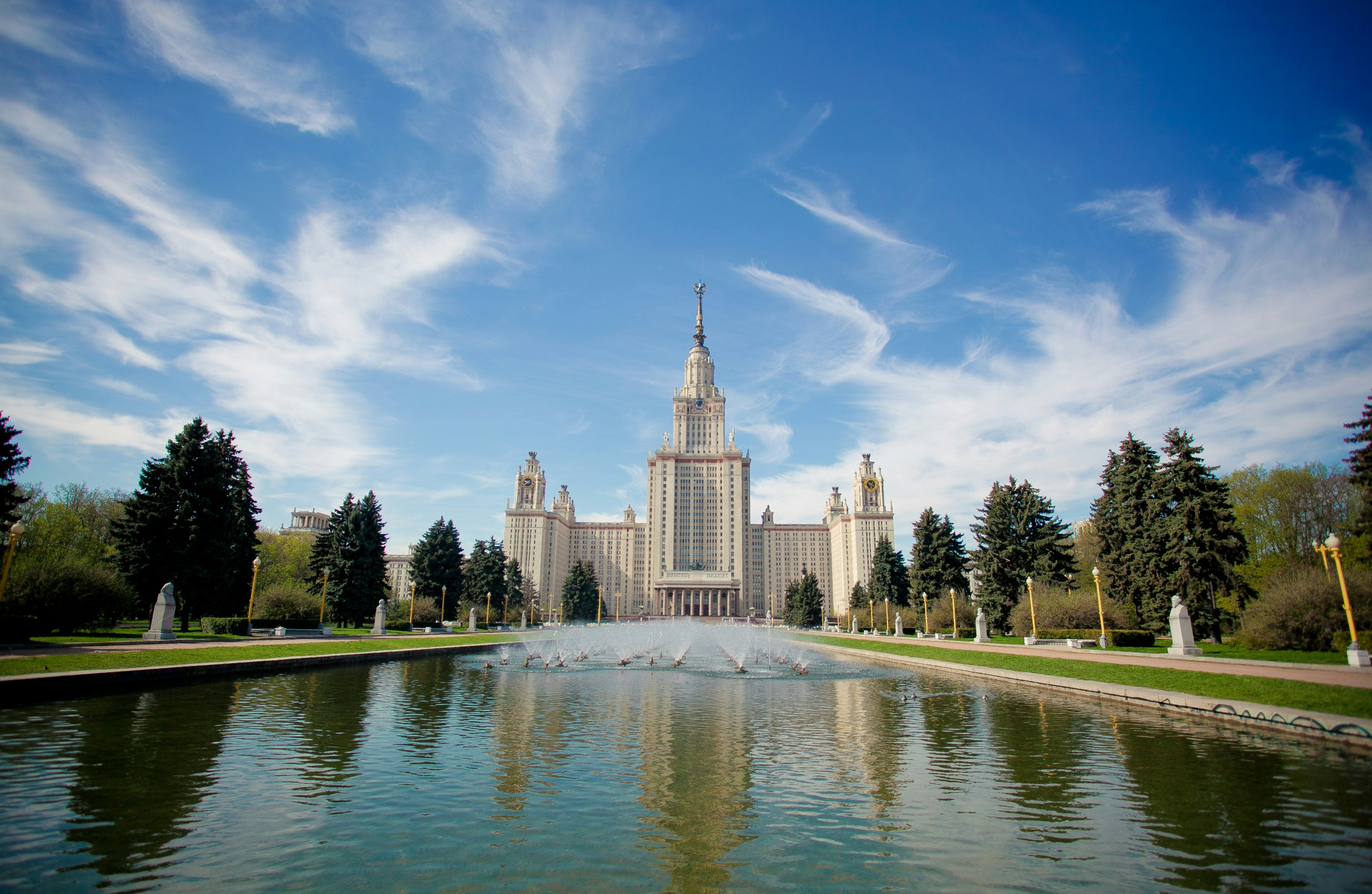 a body of water with a building in the background