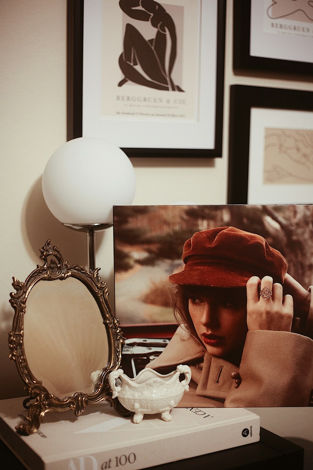 a person wearing a hat and holding a light bulb