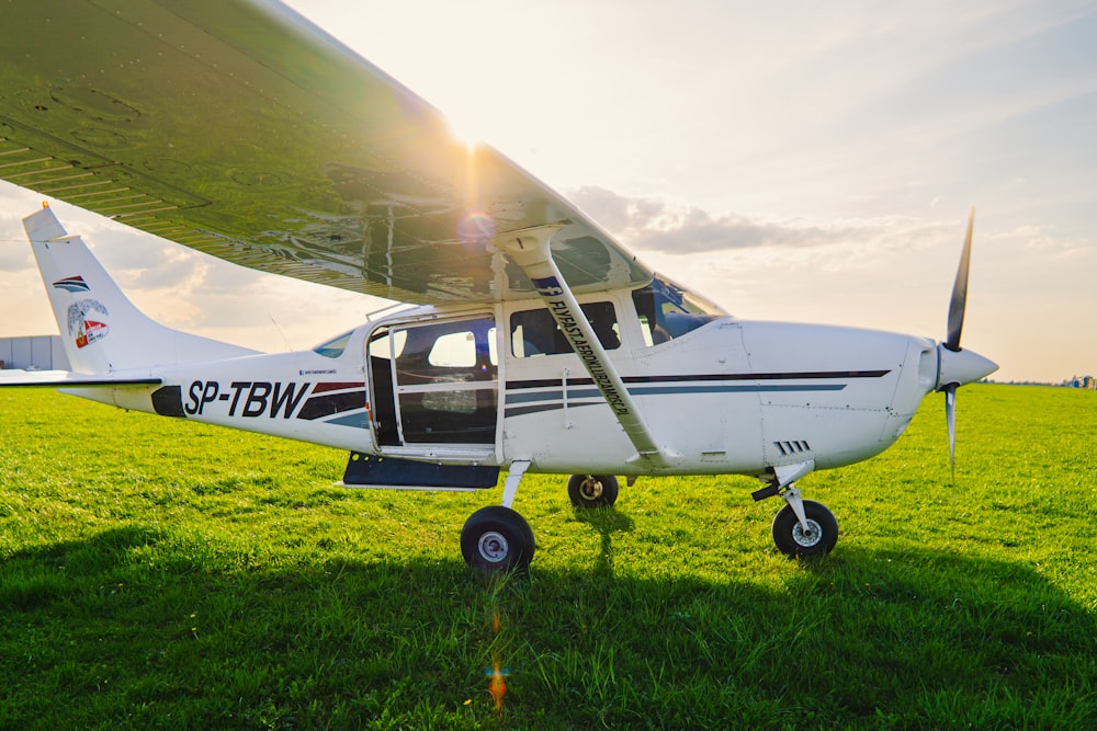 a small airplane on the grass