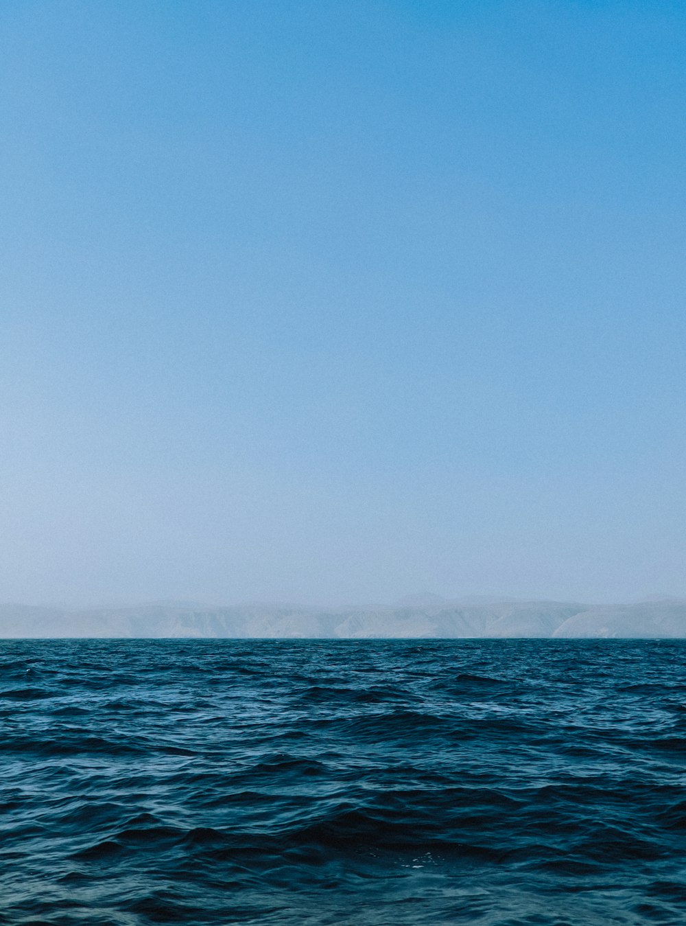 a body of water with a land in the distance