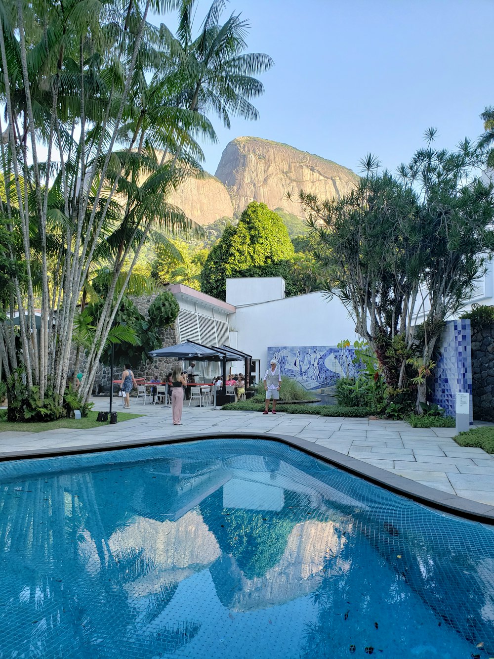 a pool with a building in the background