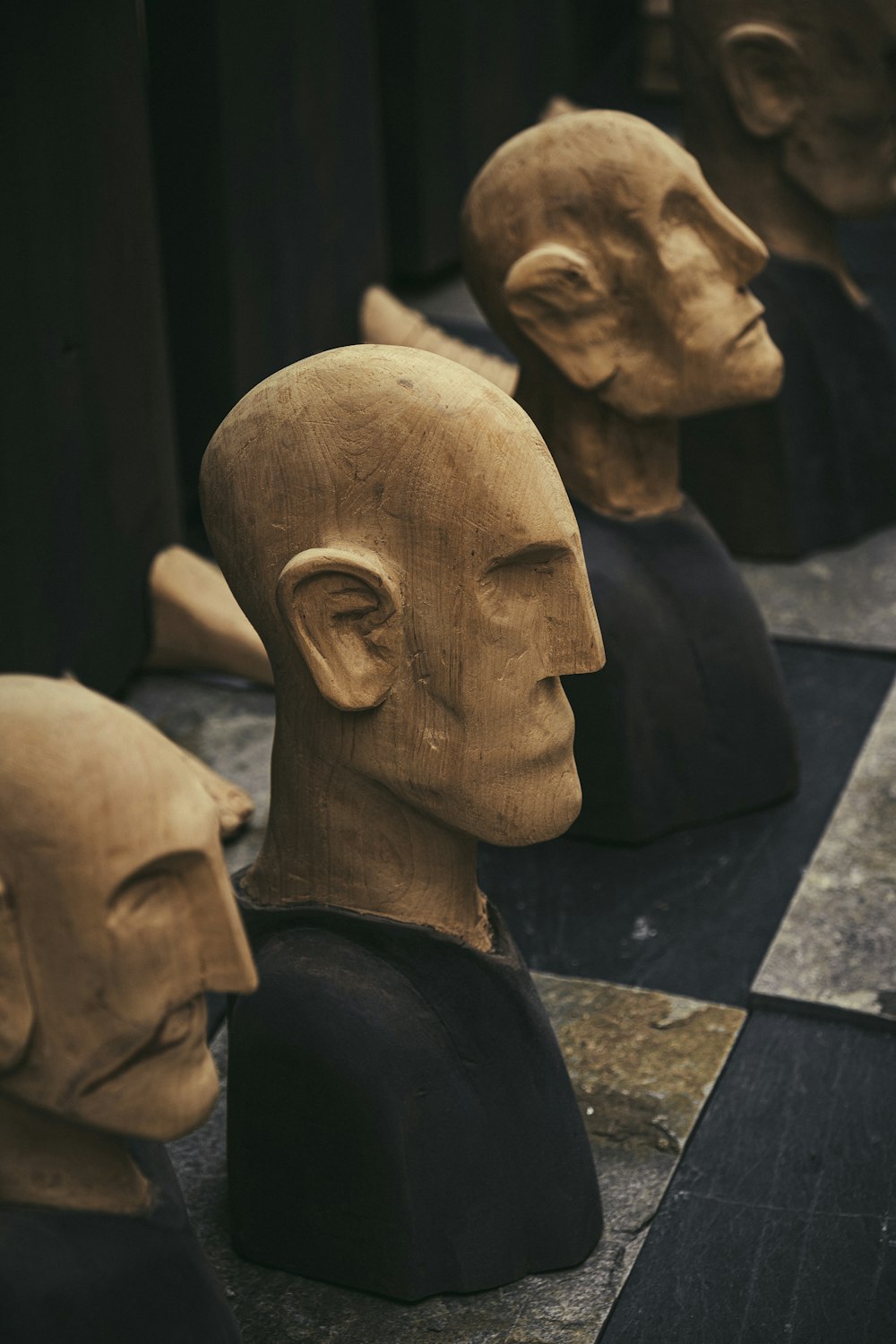 a group of clay heads