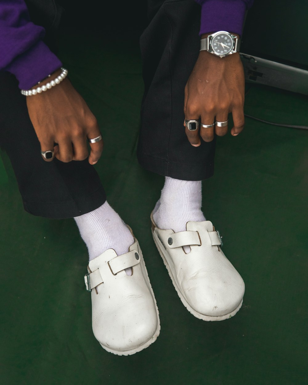 a pair of feet with white shoes