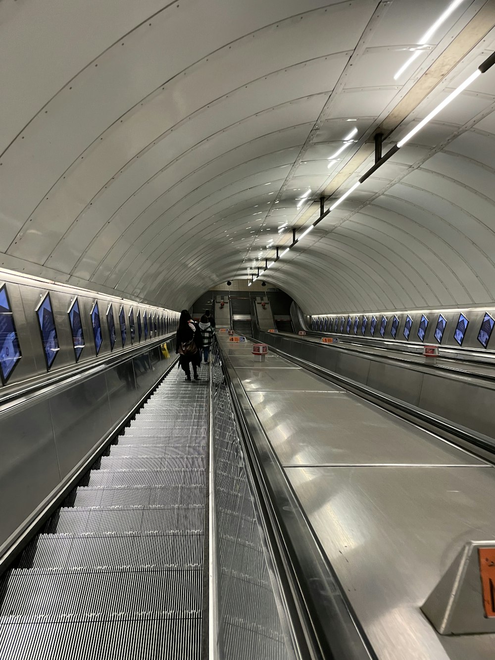 a train station with people walking