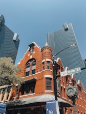 a clock tower next to a large building