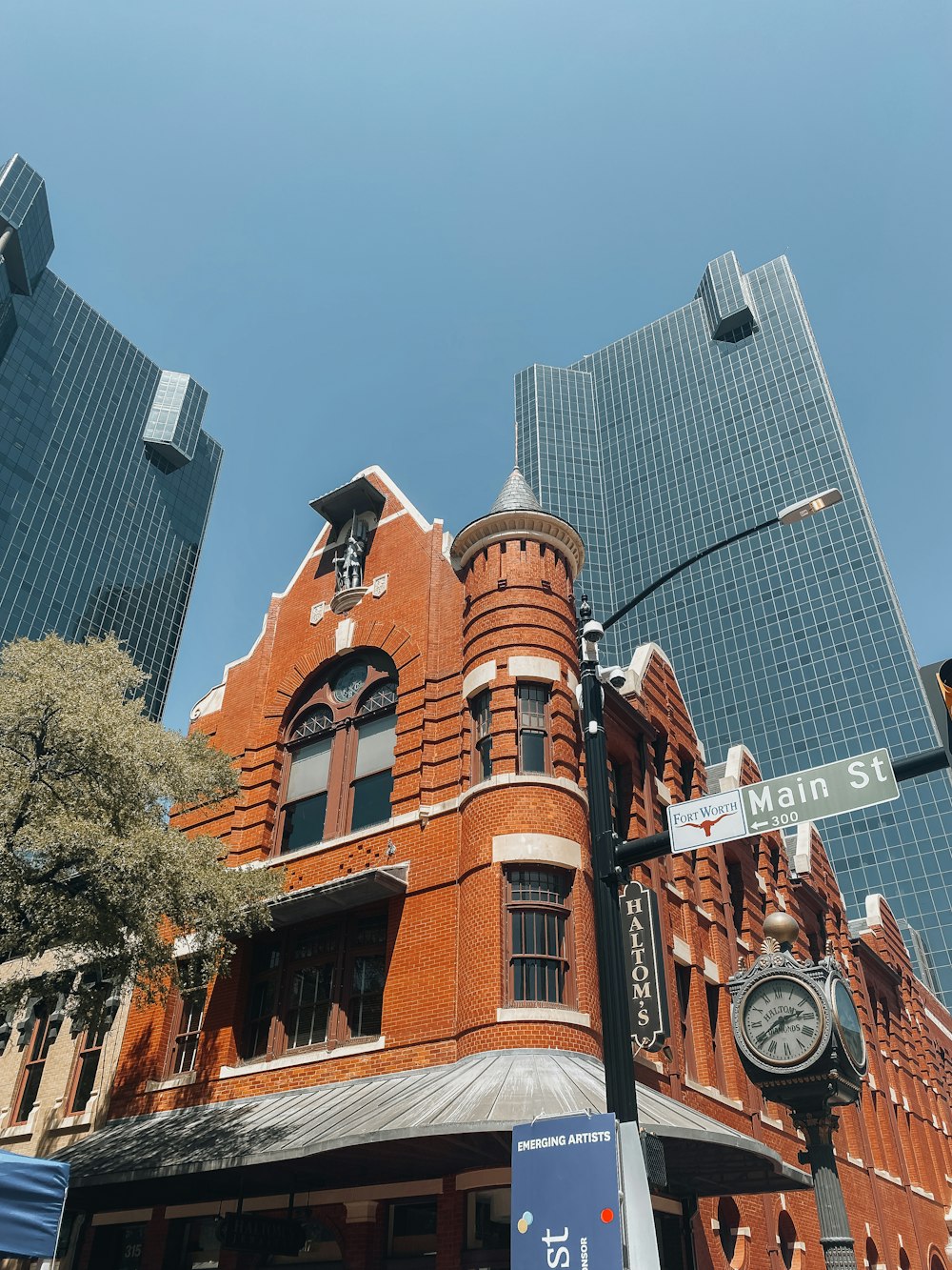 a clock tower next to a large building