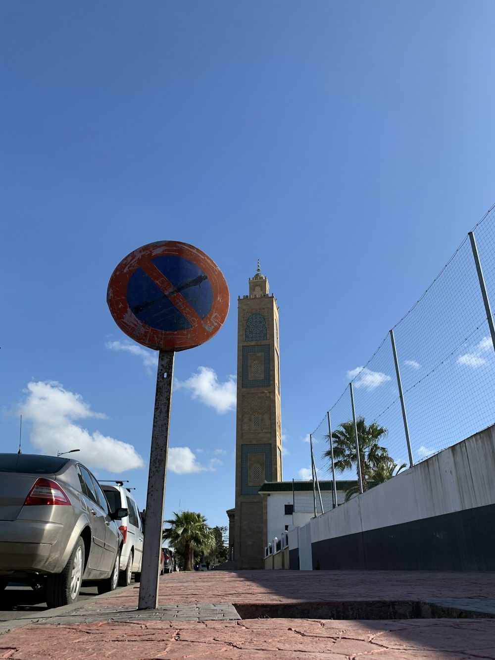 a clock tower next to a road
