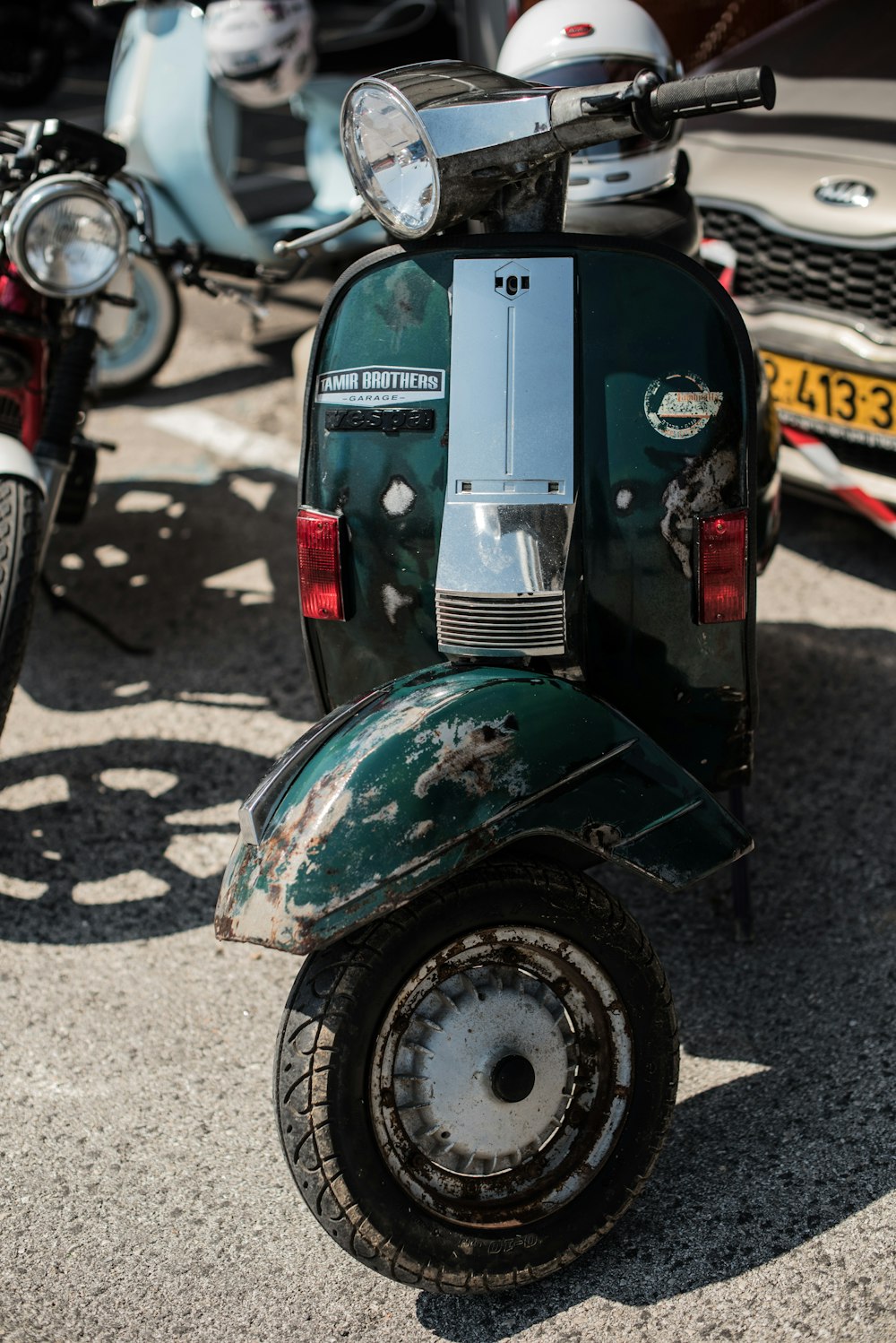 a green and white scooter