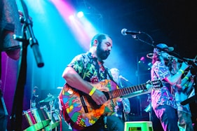 a person playing a guitar on a stage