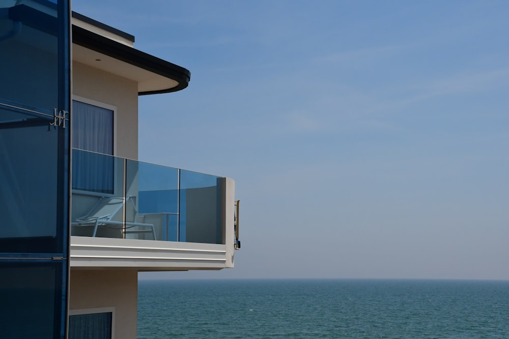 a building with a body of water in the background