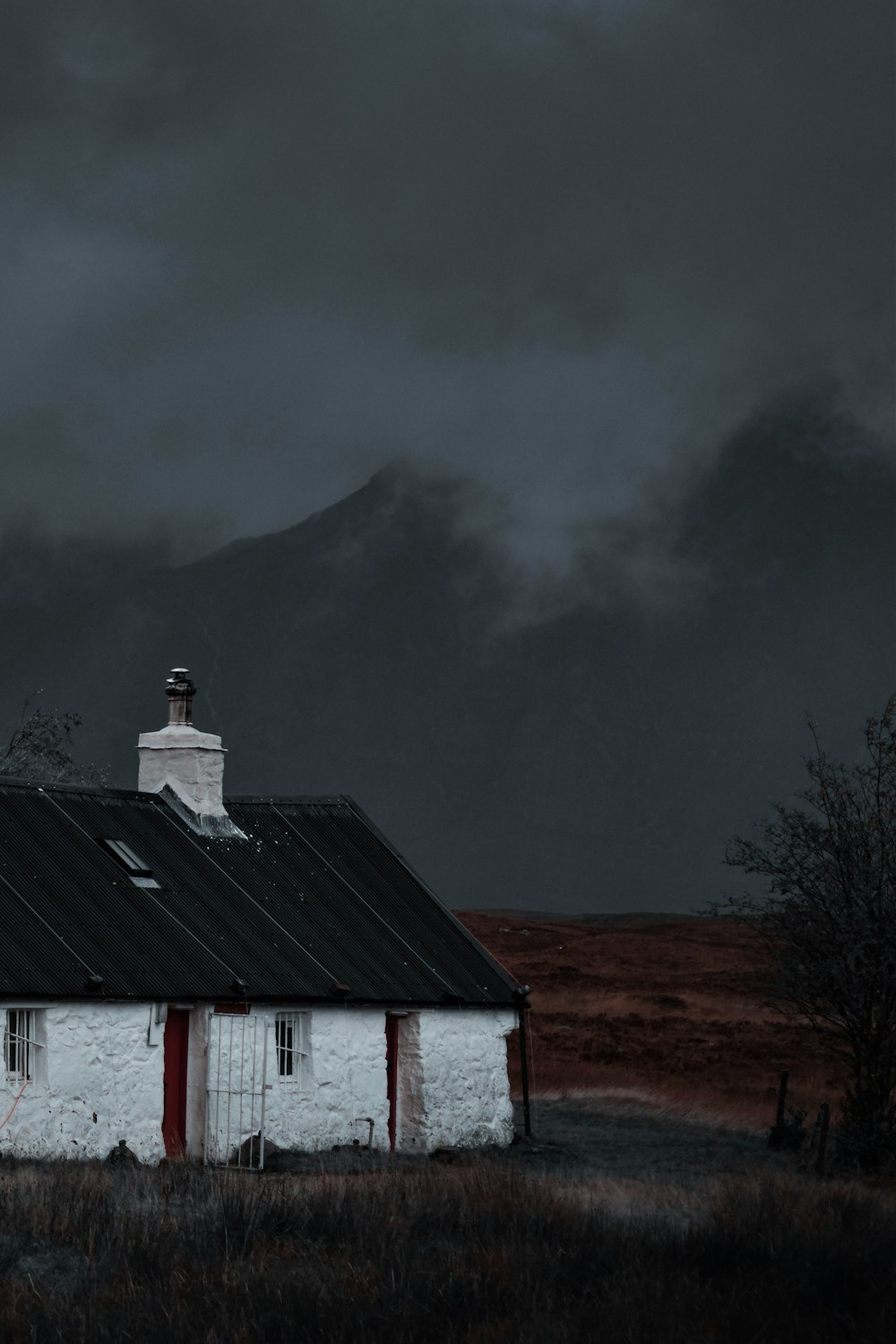 a house with a mountain in the background