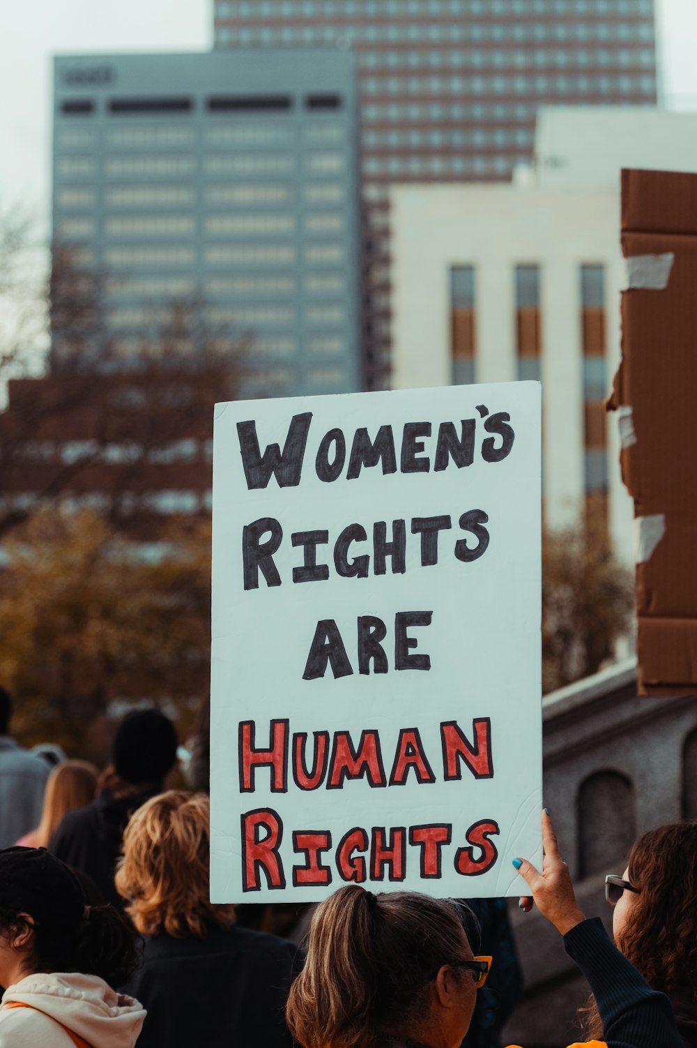 a group of people holding a sign