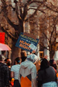 a group of people holding signs