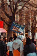 a group of people holding signs
