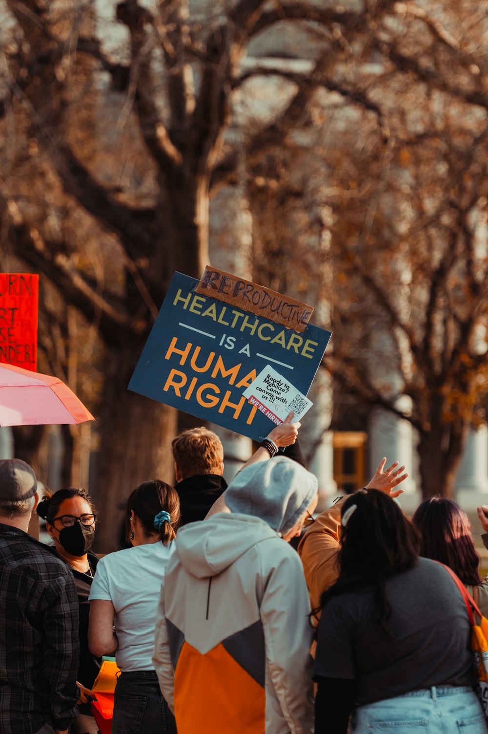 a group of people holding signs