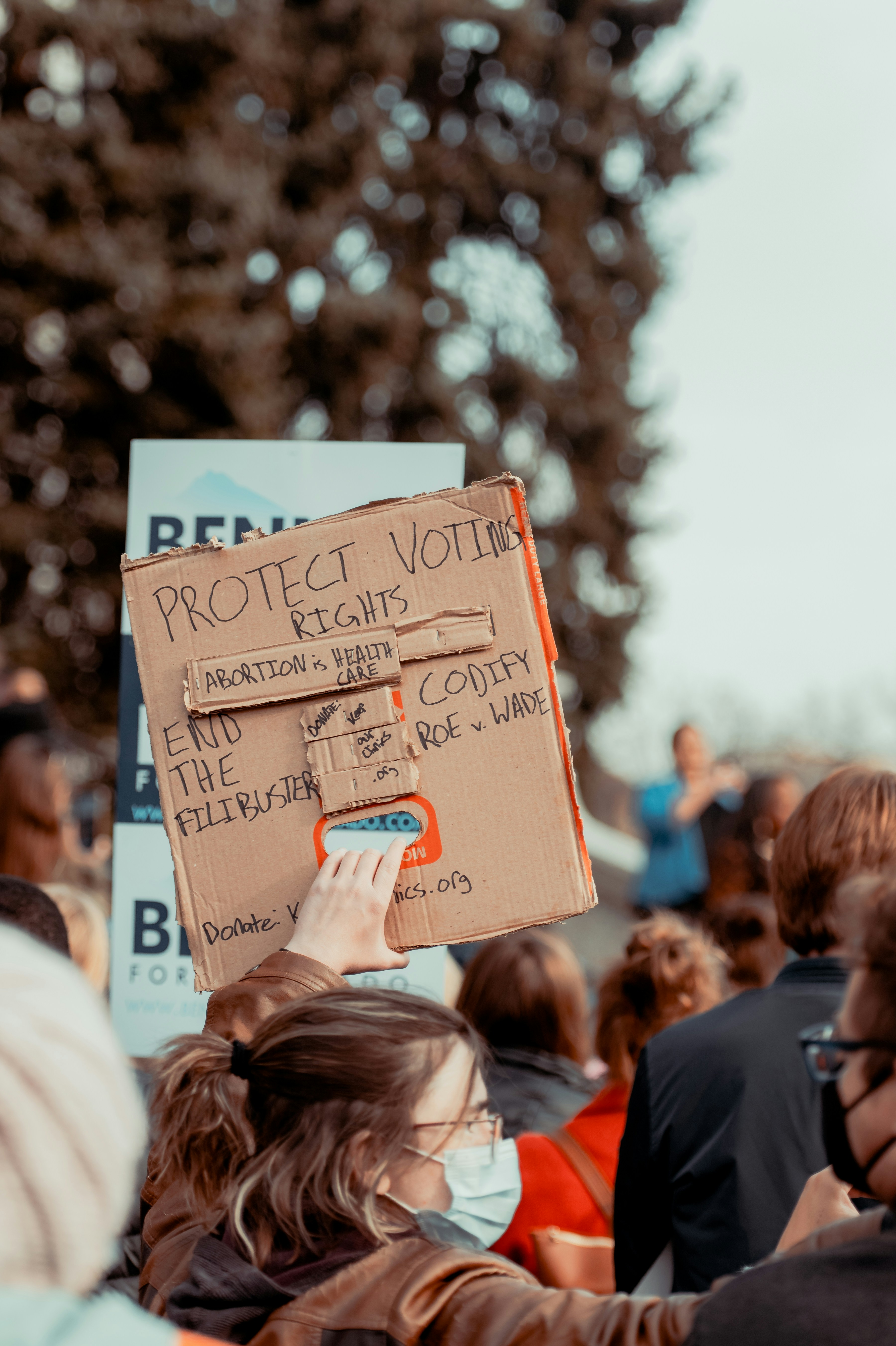 a group of people holding signs