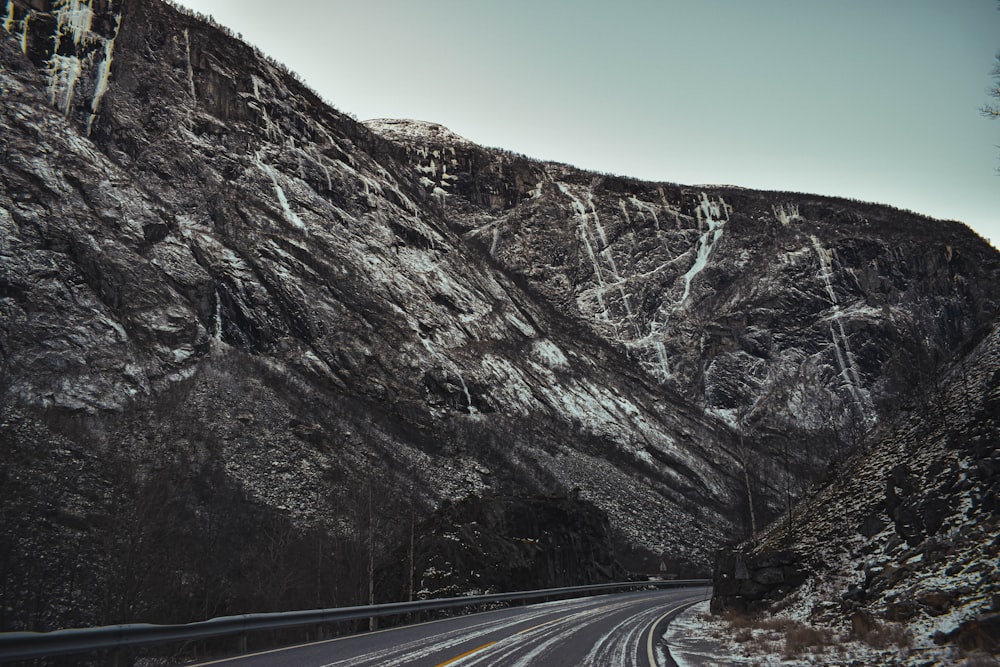 a road with snow on the side