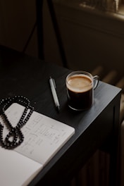 a glass of liquid on a table