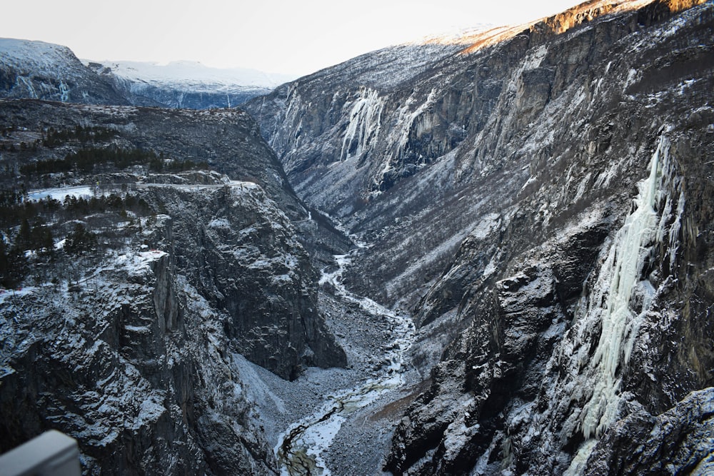 a rocky mountain with snow