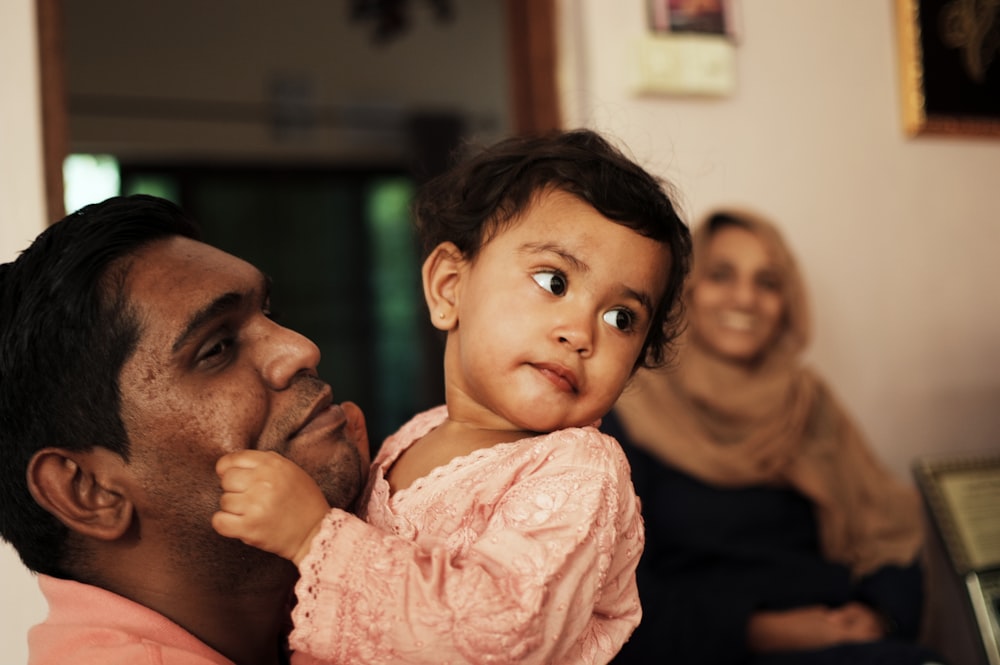 a person holding a baby