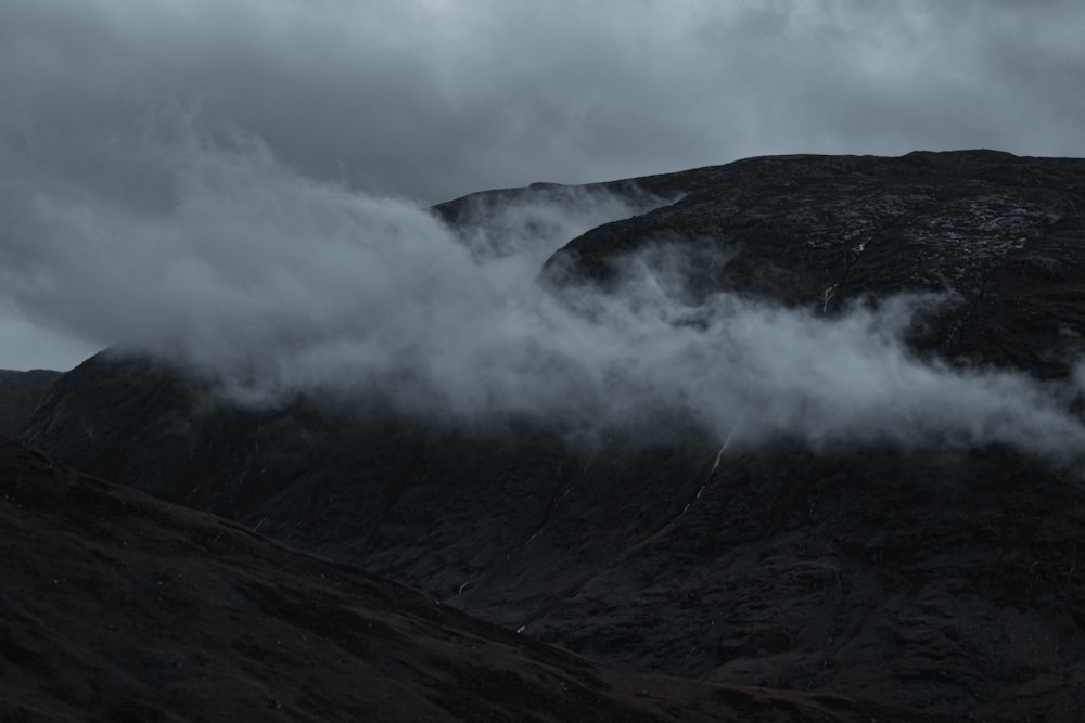 a mountain with clouds