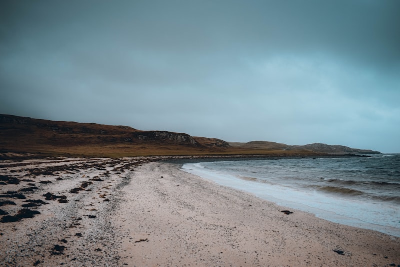 Quiet moody shoreline with a low headland on the Galloway coast