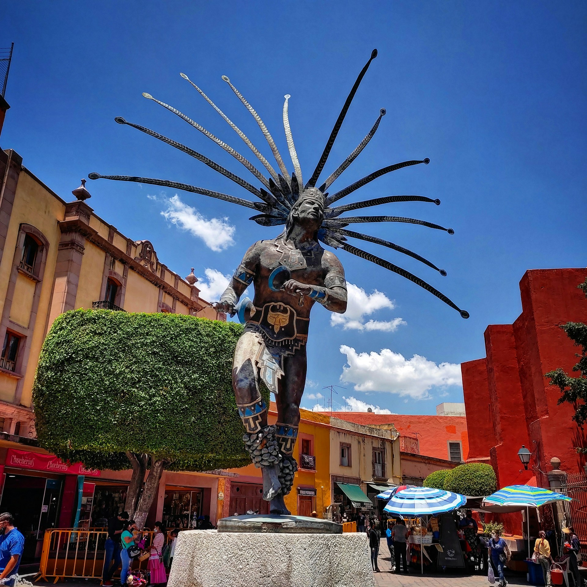 a statue of a person holding a sword
