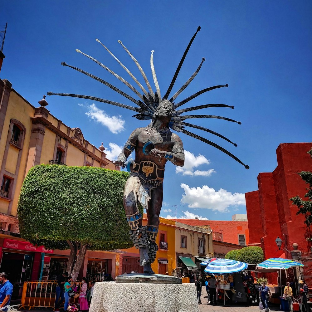 a statue of a person holding a sword