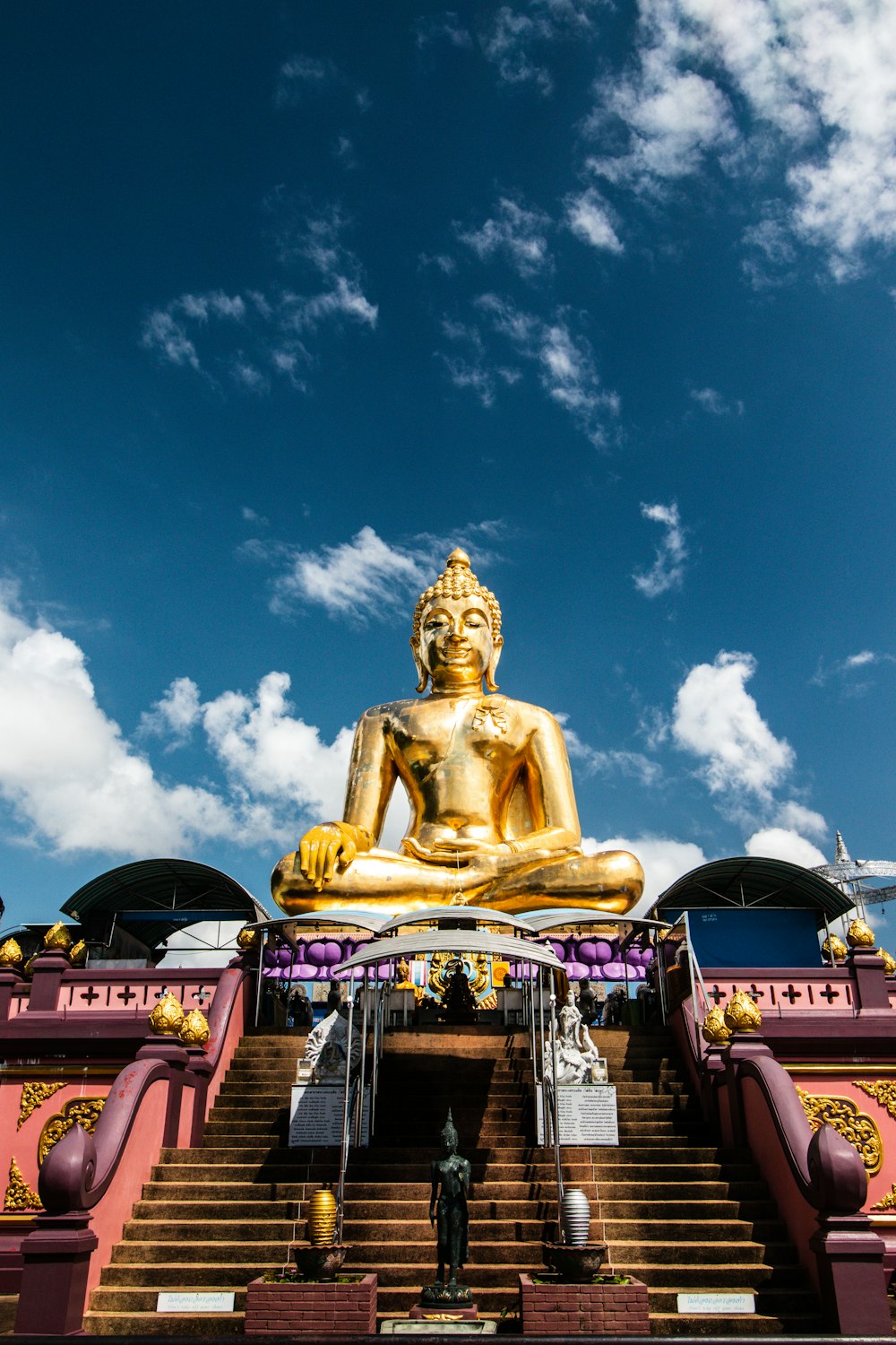 a large gold statue on a pedestal