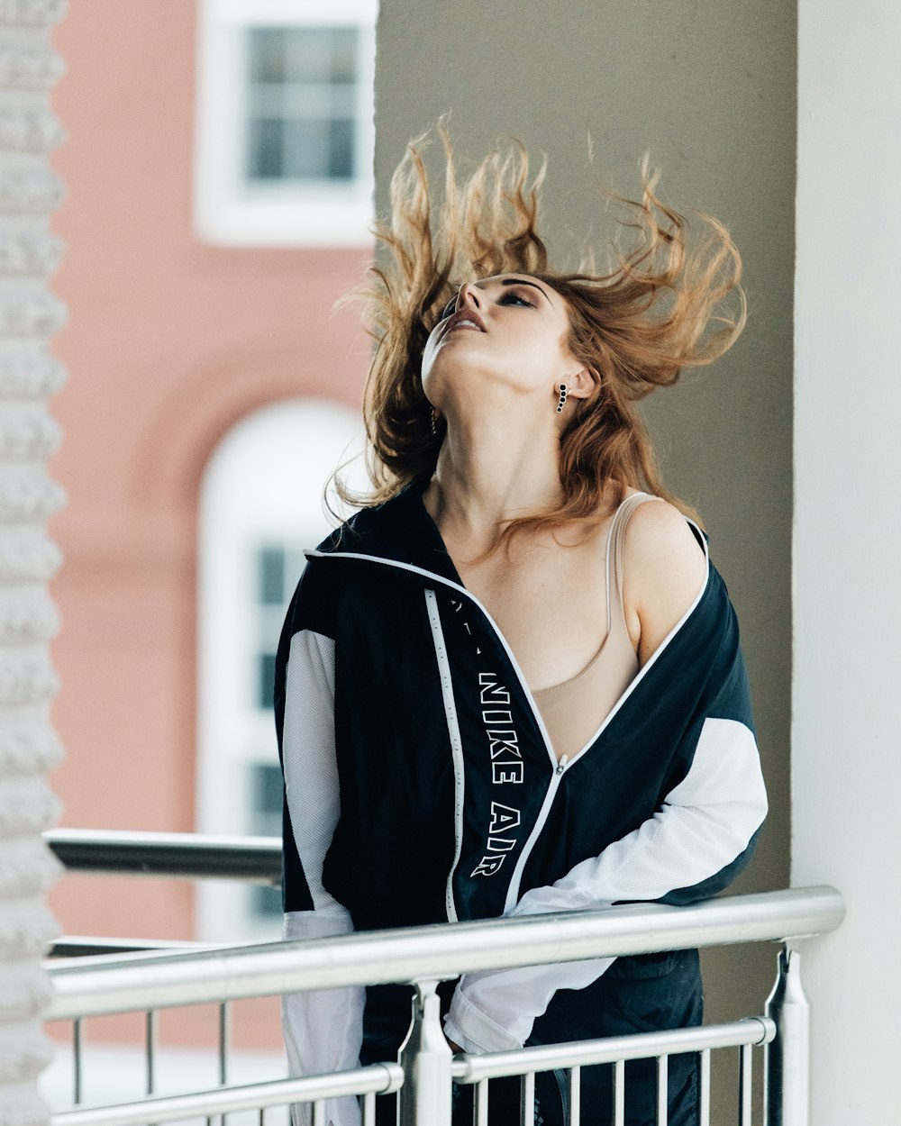 a woman leaning on a railing