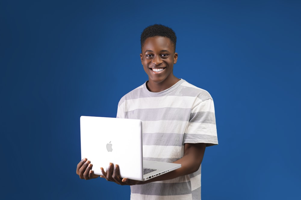 a person holding a laptop