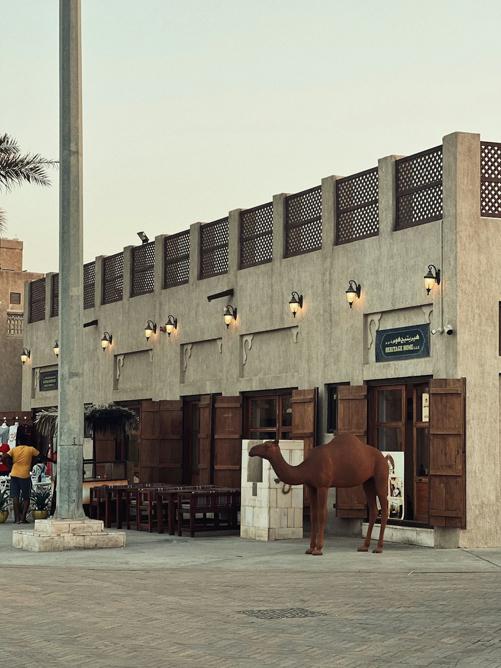 a camel statue in front of a building