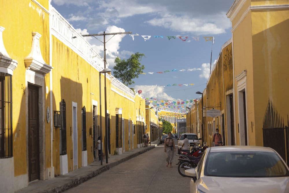 a street with cars and people