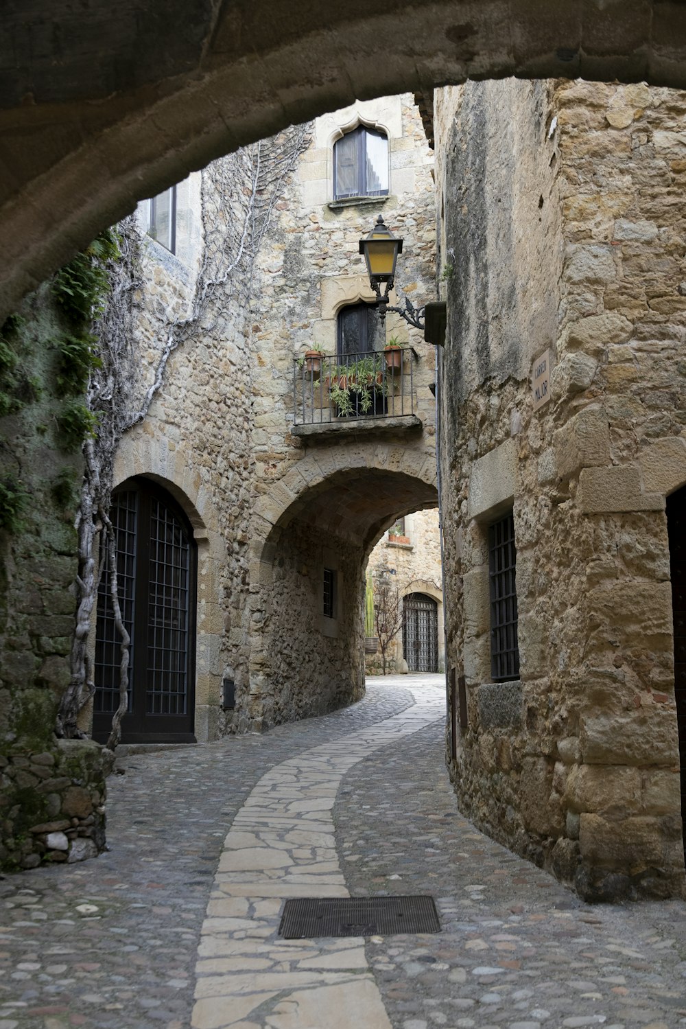 a stone building with a stone walkway