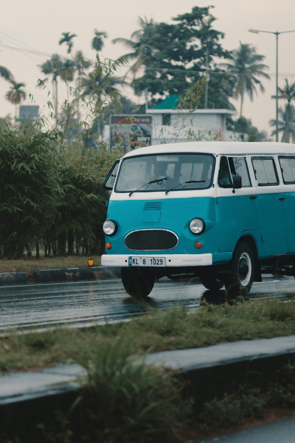 a blue van on a road