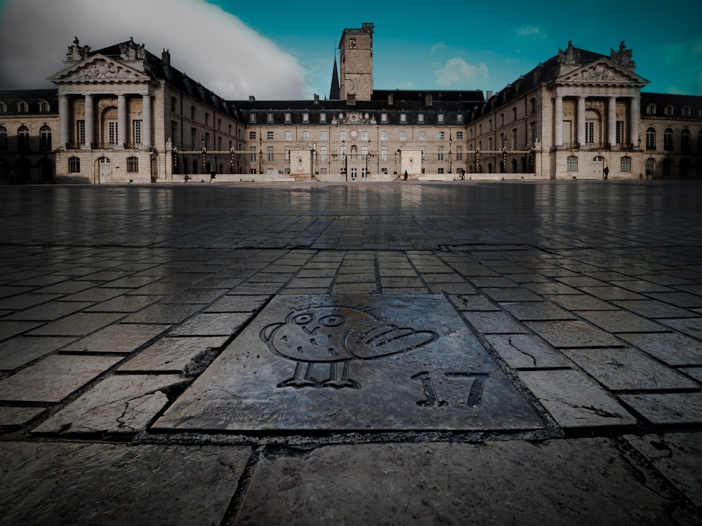 a courtyard with buildings in the background