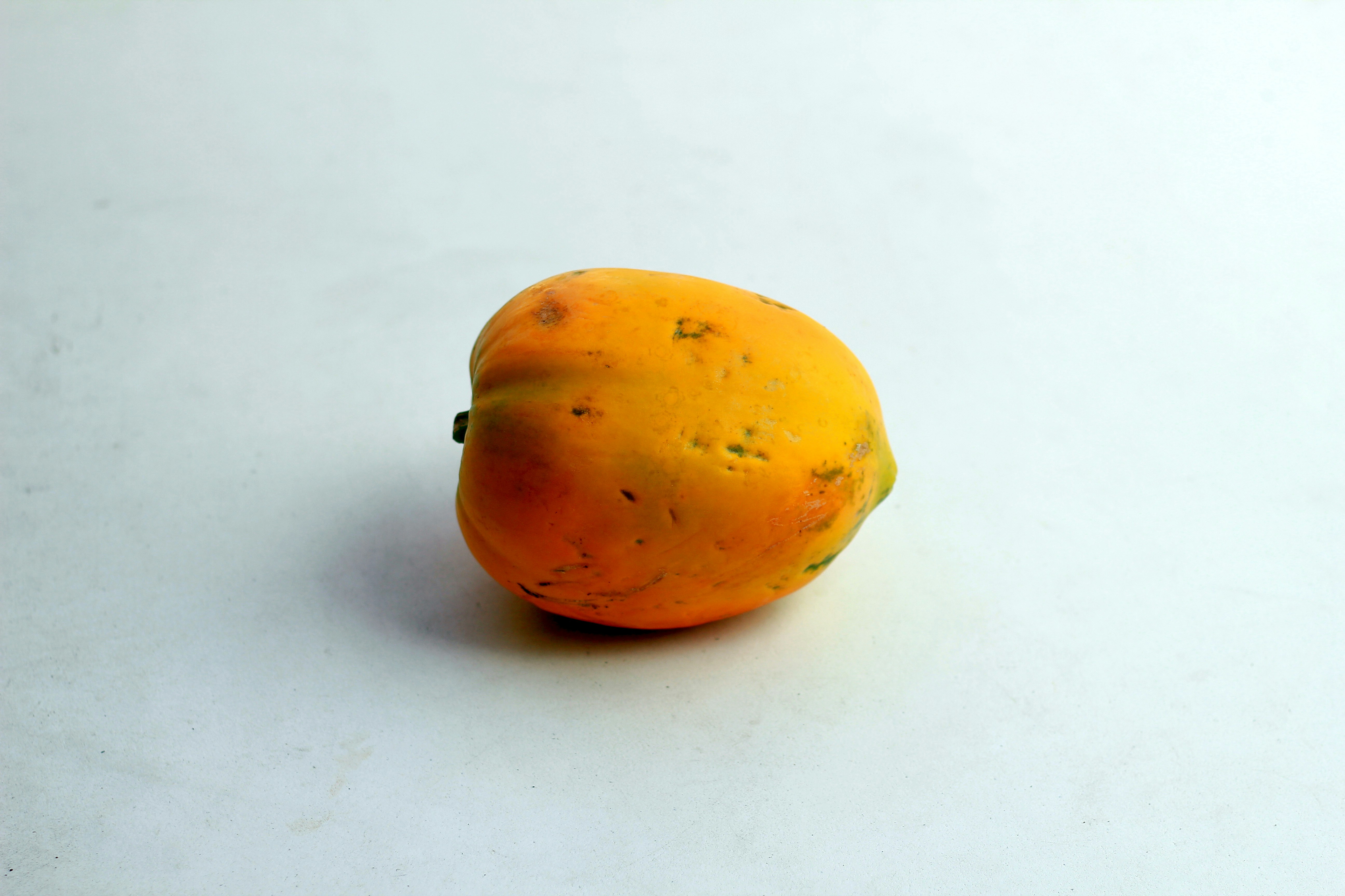 Small Yellow papaya with white background