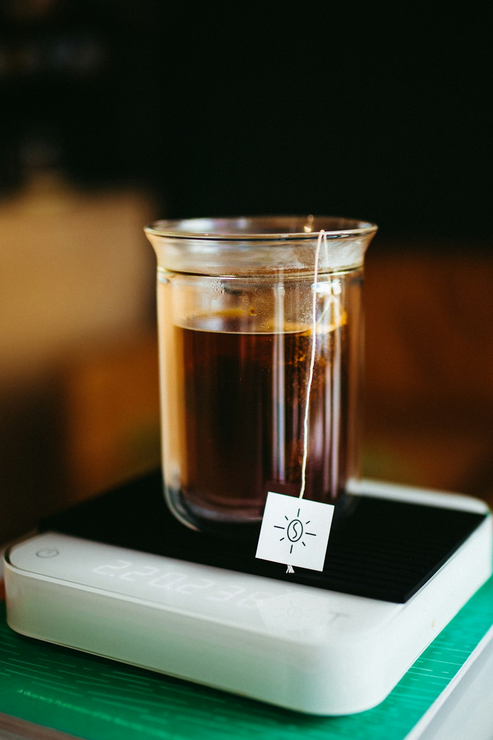 a glass jar with a brown liquid