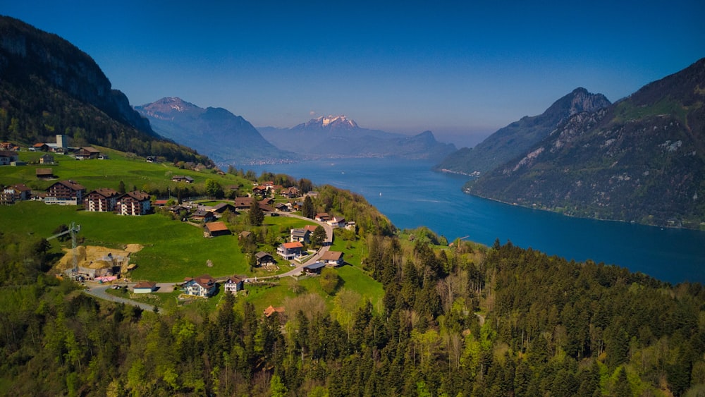 a town on a hill by a lake